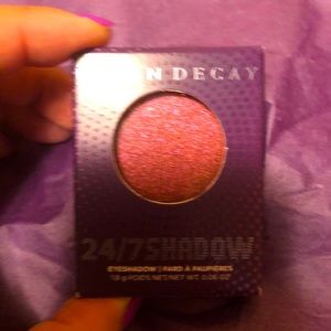 Urban Decay Eyeshadow in shimmery pink.  The color is “Floored”.